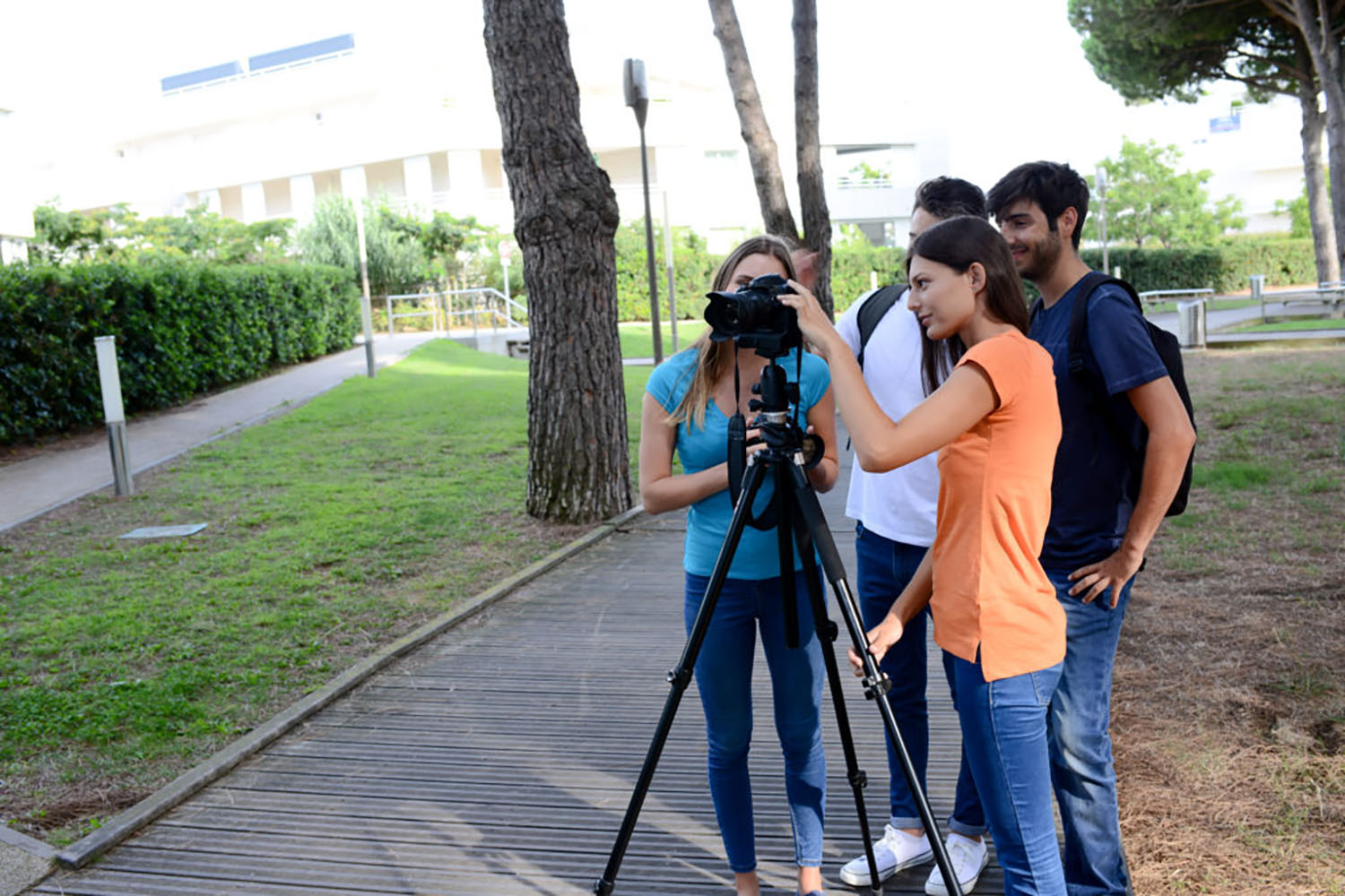 group young photography students with teacher during outdoor photo course