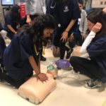 students performing CPR on dummies