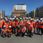 engineering students with hard hats and orange vests