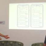 two kids presenting mobile app