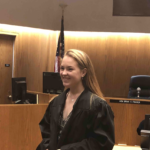blonde girl in judge's robe