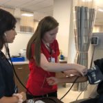 students taking blood pressure